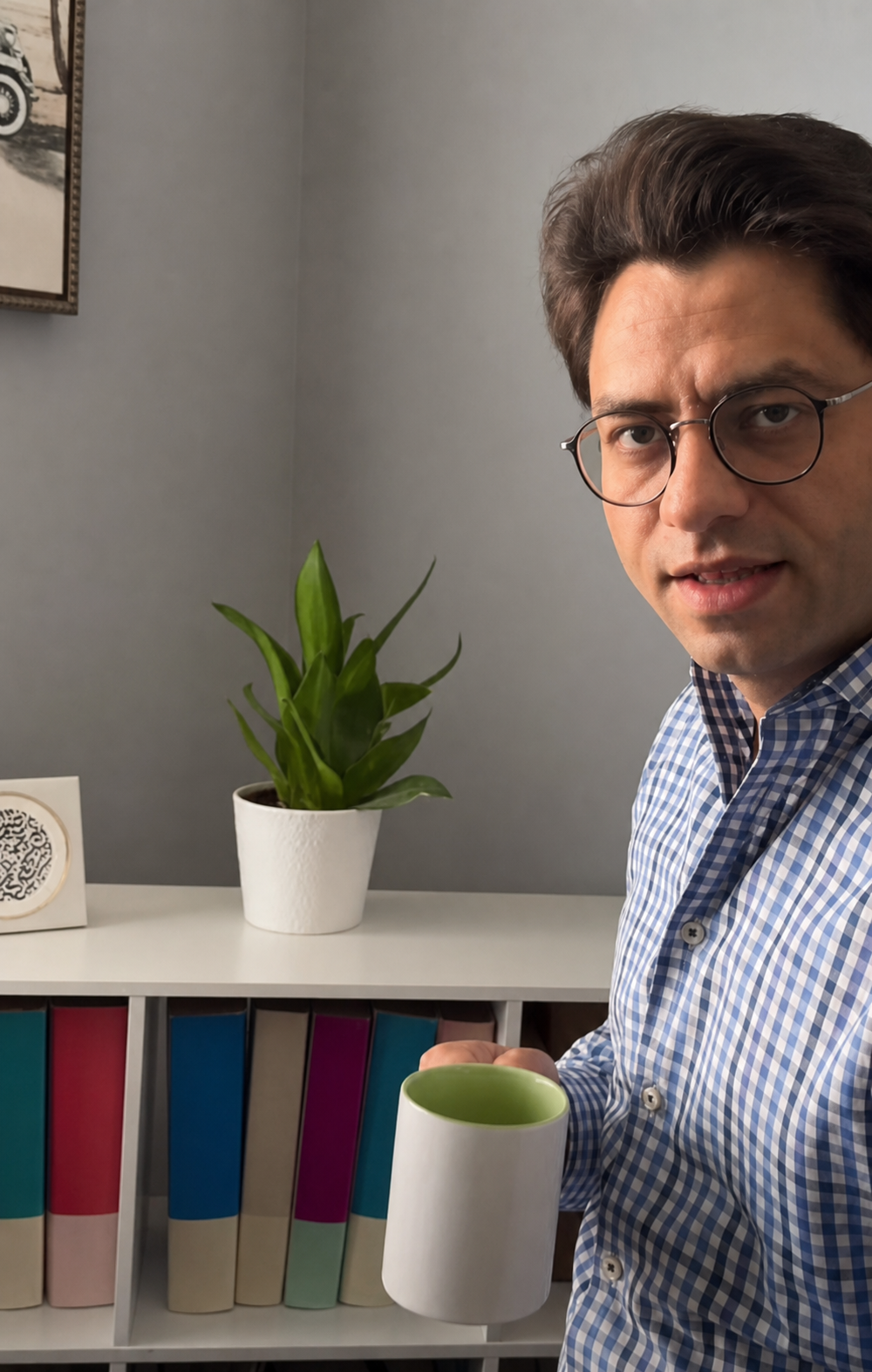 Tarif Homsi in an office holding a NoorVest mug.
